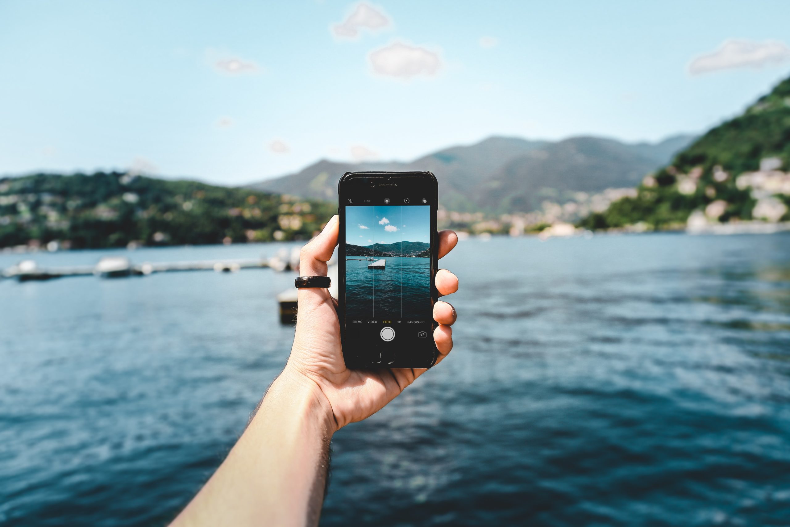 iphone taking picture of a lake and shoreline