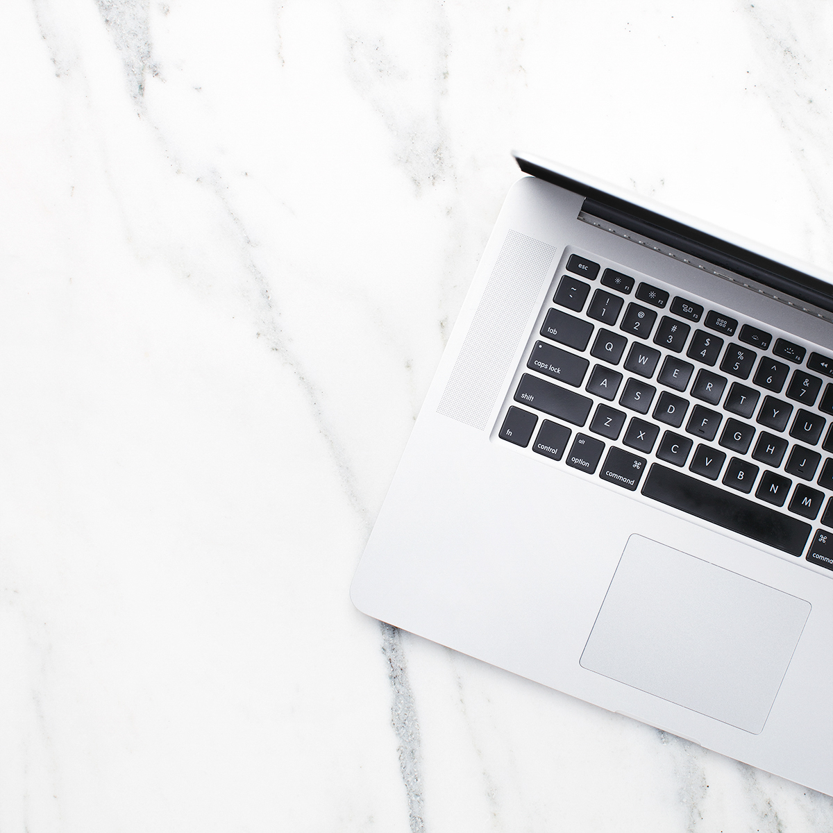laptop on marble counter
